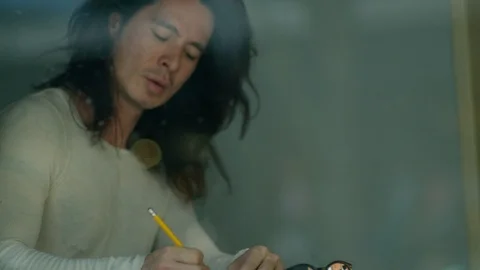 Handsome man drawing sketch in diary Stock Footage 107028531