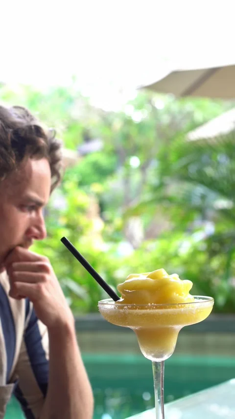 Handsome man drinking cocktail Video stock 218037931