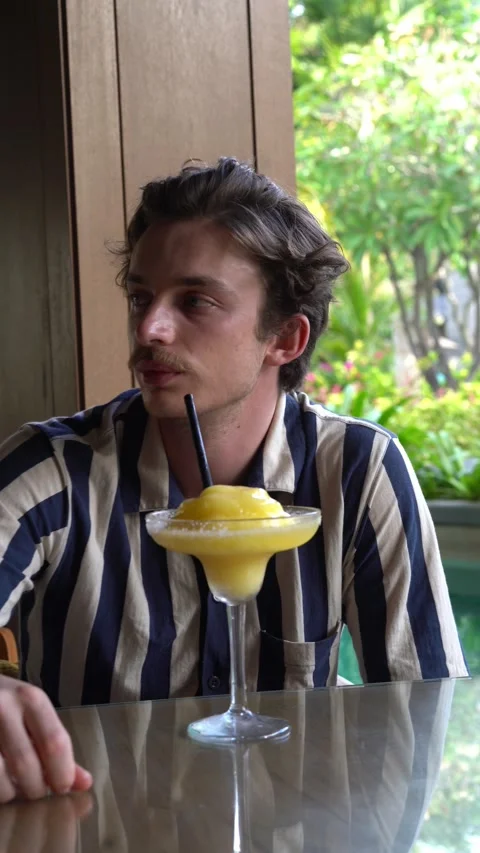 Handsome man drinking cocktail Video stock 218038004