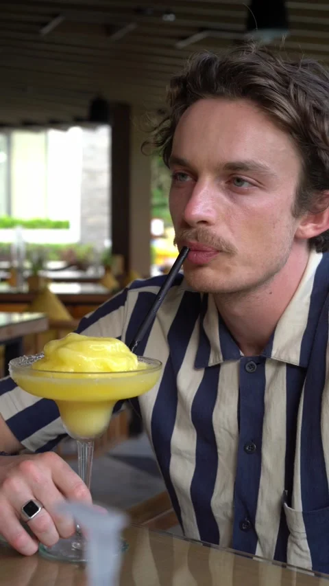 Handsome man drinking cocktail Video stock 218038039