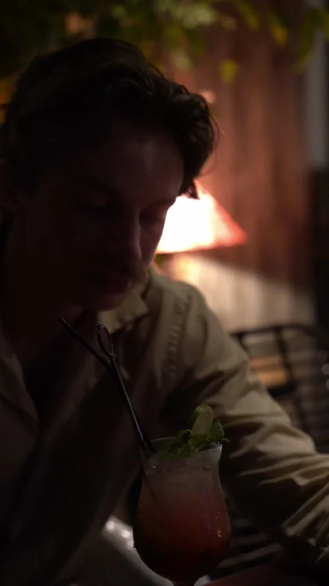 Handsome man drinking cocktail Video stock 218039021
