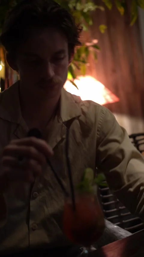 Handsome man drinking cocktail Video stock 218039172