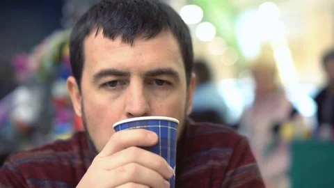Handsome man drinking coffee at the mall. Stock Footage 83859906
