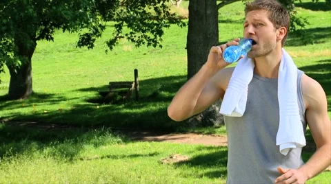 Handsome man drinking water Stock Footage 2912066