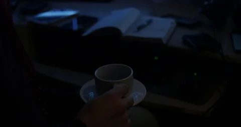 A handsome man drinks coffee and work with graphs Stock Footage 88058318