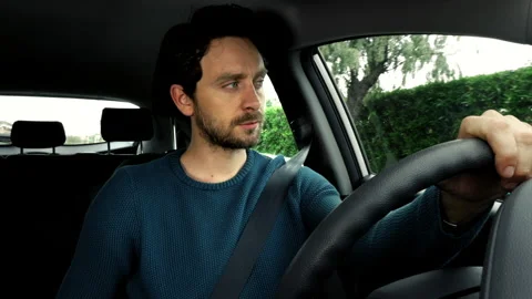 Handsome man driving car after end of quarantine isolation corona virus happy Stock Footage 131268728