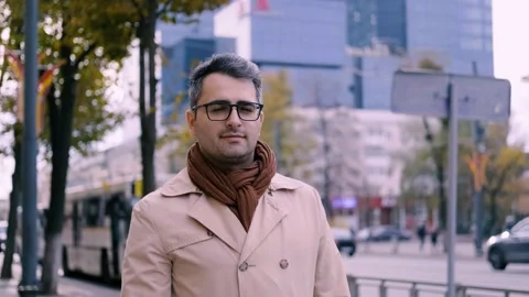 A handsome man of Eastern appearance, a poet and artist with glasses walk 스톡 동영상 142351281