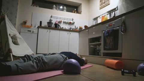 Handsome Man Exercising in The Kitchen at Home Video stock 107925911