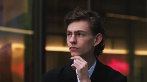 Handsome man face looking distance outdoors. Closeup young businessman thinking Stock Footage 243590657