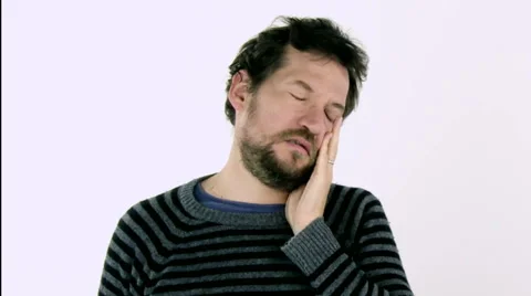 Handsome man feeling tired and starting to feel flu and headache slow motion. Stock Footage 44398934