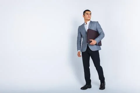 Handsome man with folder man reading a menu, a stylish business guy in suit i Stock Photos