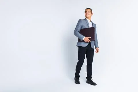 Handsome man with folder man reading a menu, a stylish business guy in suit i Stock Photos