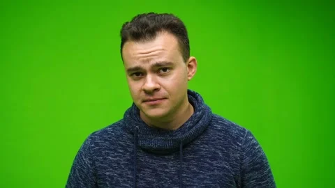 Handsome man friendly looking at camera over green screen background. Stock Footage 145812360