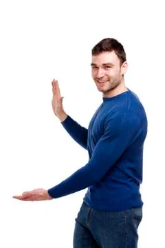 Handsome man gesturing to the left isolated on white Stock Photos