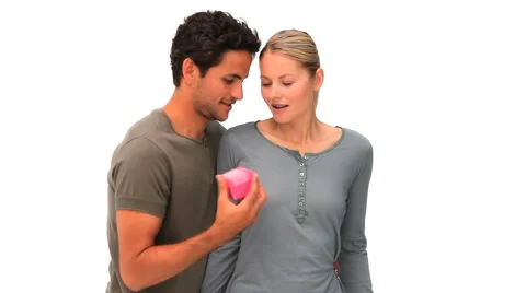 Handsome man giving a gift to his girlfriend Stock Footage