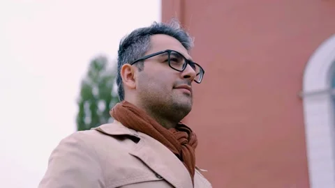 Handsome man with glasses. camera rotation around guy 360 degrees. Slow motion Stock Footage 142509960