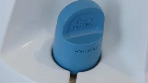 Handsome man hands opening the pressurised demineralised water container of a Stock Footage 127372050