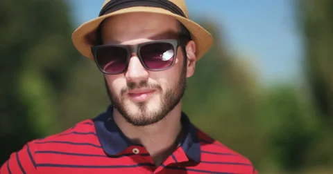 Handsome man with hat smiling to the camera Video stock 59527553