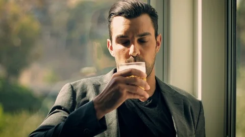 Handsome man having a drink Vídeo Stock 111604206