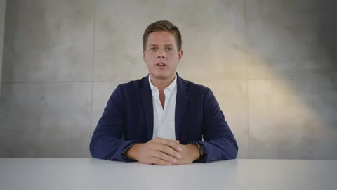 Handsome man having job interview. Caucasian male Looking at camera and Stock Footage 164452489