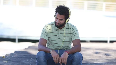 Handsome man with headphones listening to music Stock Footage 59555467
