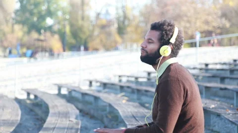 Handsome man with headphones listening to music Stock Footage 59555974