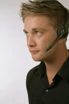 Handsome man with headset Stock Photos