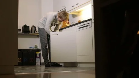 A handsome man in his pajamas in the kitchen. Stock Footage 71777657