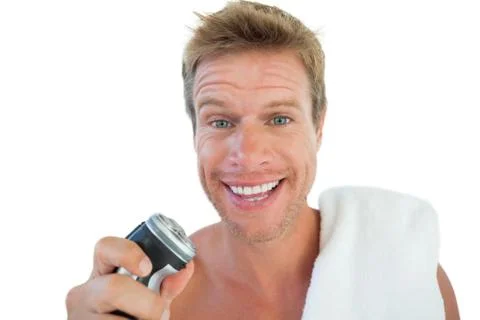 Handsome man holding an electric razor Stock Photos