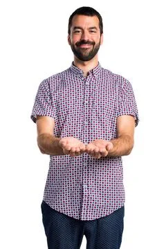 Handsome man holding something Stock Photos