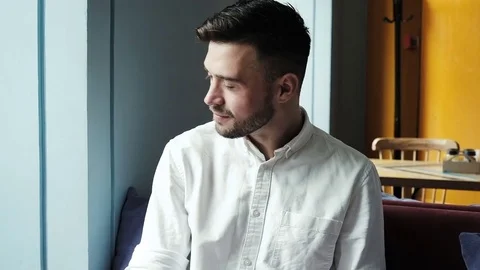 Handsome man at home drinking coffee. loft apartment Stock Footage 77001018