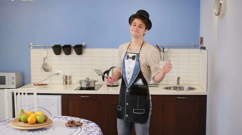 Handsome man involved in preparing meal at kitchen Stock Footage 66300608