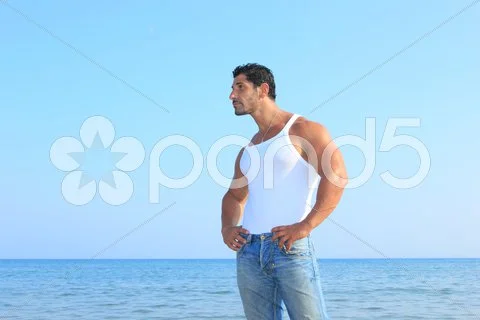 Handsome Man In Jeans By The Sea