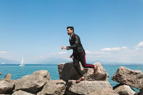 Handsome man jumping in a vacation context Stock Photos