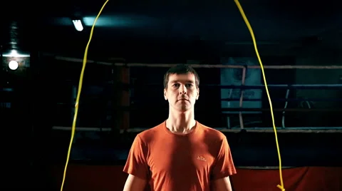 Handsome man jumps with a jumping rope, slow motion 2 Stock-Footage 65760384