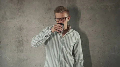 Handsome man on kitchen is smiling and drinking coffee at home, good morning Stock Footage 140200736