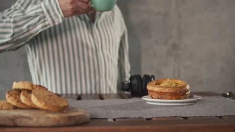 Handsome man on kitchen is smiling and drinking coffee at home, good morning Stock Footage 140200877