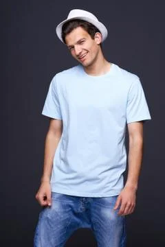 Handsome man laughing skeptically Stock Photos