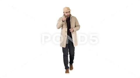 Handsome man in light trench coat talking to camera Focus and think about it Stock Photos