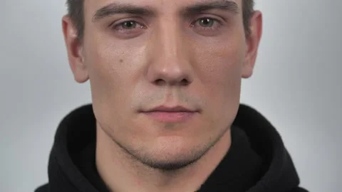 Handsome man looking at camera approvingly nodding on white background. Portrait Stock Footage 130324959