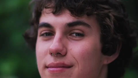 Handsome man looking at camera. Closeup positive guy smiling at camera. Portrait Stock Footage 243374545