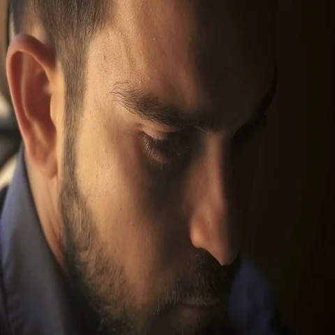 Handsome man looks at the camera intensely Stock-Footage 69514150