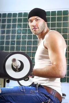 Handsome man makes exercises Stock Photos