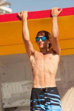Handsome man making biceps excercise 写真素材