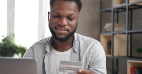 Handsome man making purchase using smartphone. Stock Footage 134816272