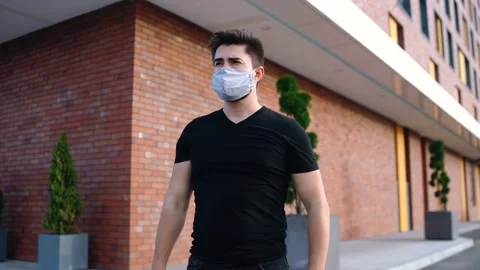 Handsome man with mask on face Stock Footage 140123484