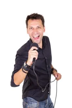 Handsome man with microphone singing Stock Photos