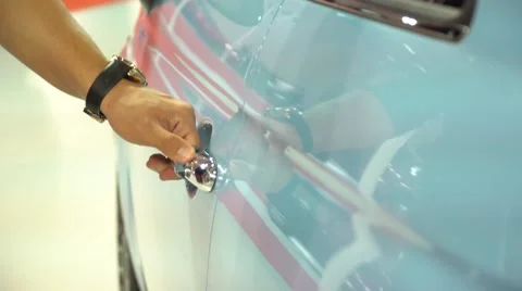 Handsome man opens door and gets in new Fiat car with blue color. Stock Footage 68927755