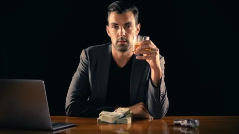 Handsome man plays with a stack of cash Stock-Footage 102527425