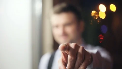 Handsome man pointing finger camera focused unfocused shirt portrait closeup Stock Footage
